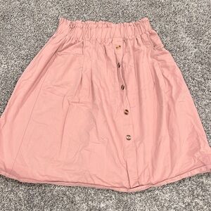 Blush pink skirt with buttons that go from top to bottom